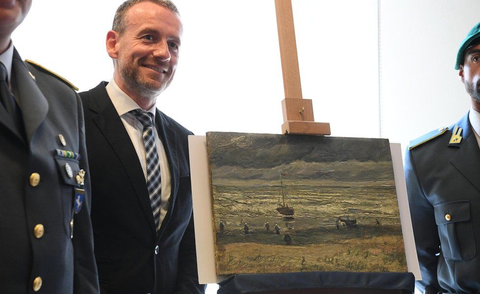 Axel Ruger, director of Amsterdam's Van Gogh Museum, stands next to the painting Seascape at Scheveningen (30 Sept)