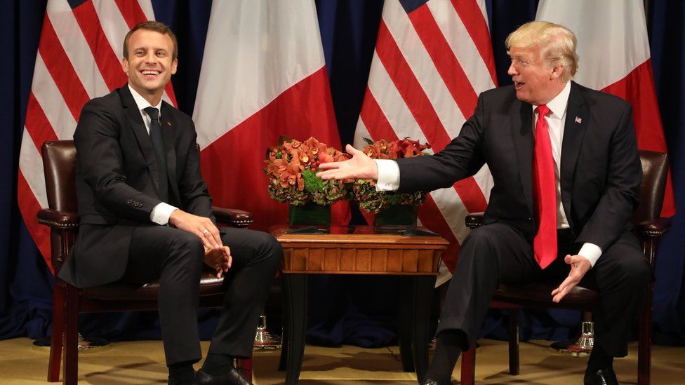 In this file photo taken on September 18, 2017 Franch President Emmanuel Macron (L) laughs with US President Donald Trump before a meeting at the Palace Hotel during the 72nd session of the United Nations General Assembly in New York.