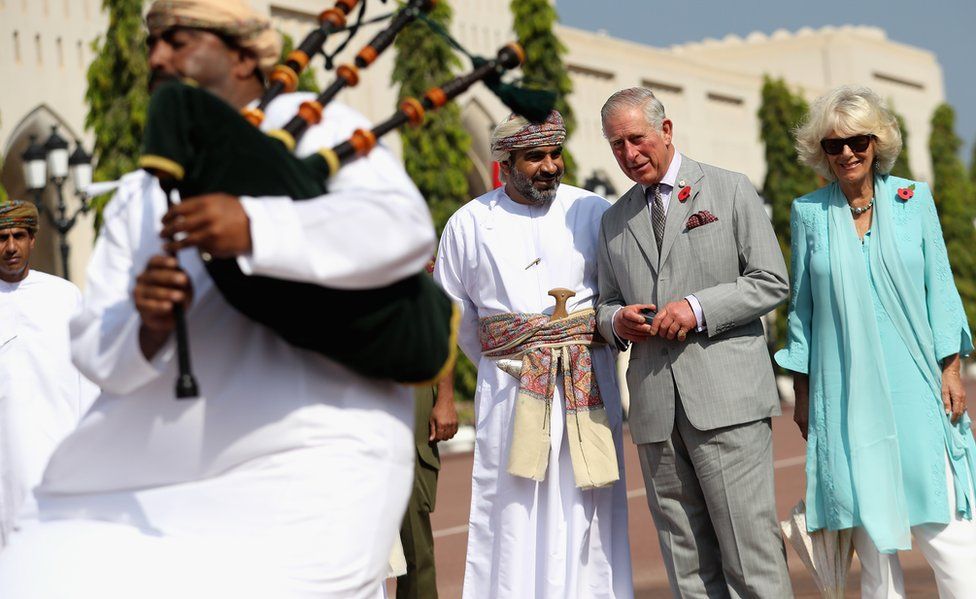 Charles and Camilla look on during a cultural welcome ceremony