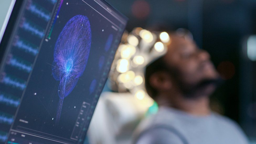 A man wearing a brain monitor