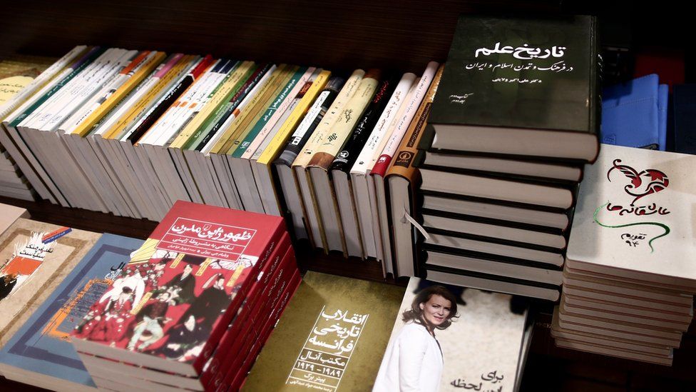 Piles of Persian-language books in an Iranian bookshop
