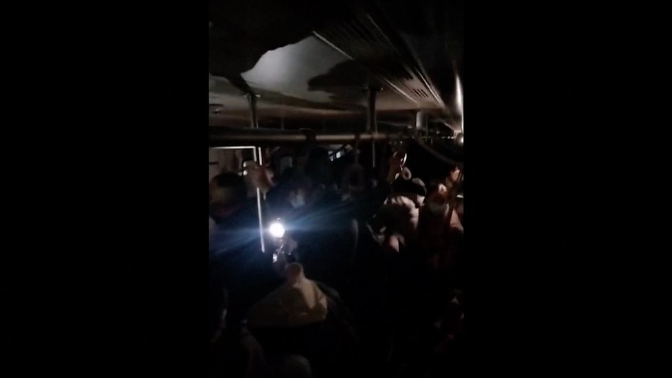 Pictures and videos online show commuters crowded in the carriages, left in the dark due to power cuts