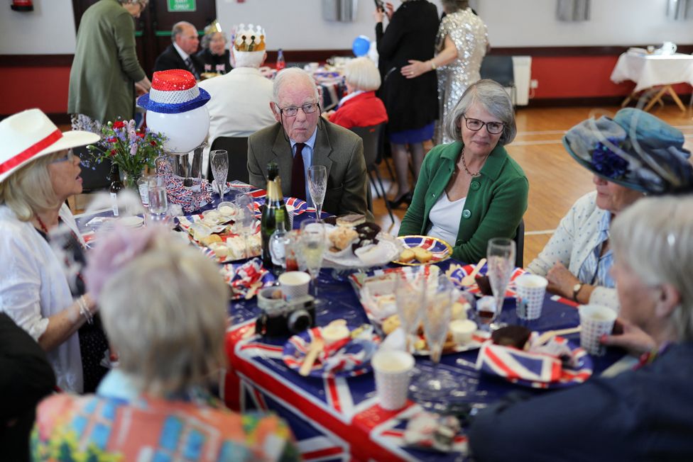 People take part in a Coronation Big Lunch to celebrate King Charles' coronation, at Kilbride parish church in the village of Doagh, Northern Ireland, May 7, 2023