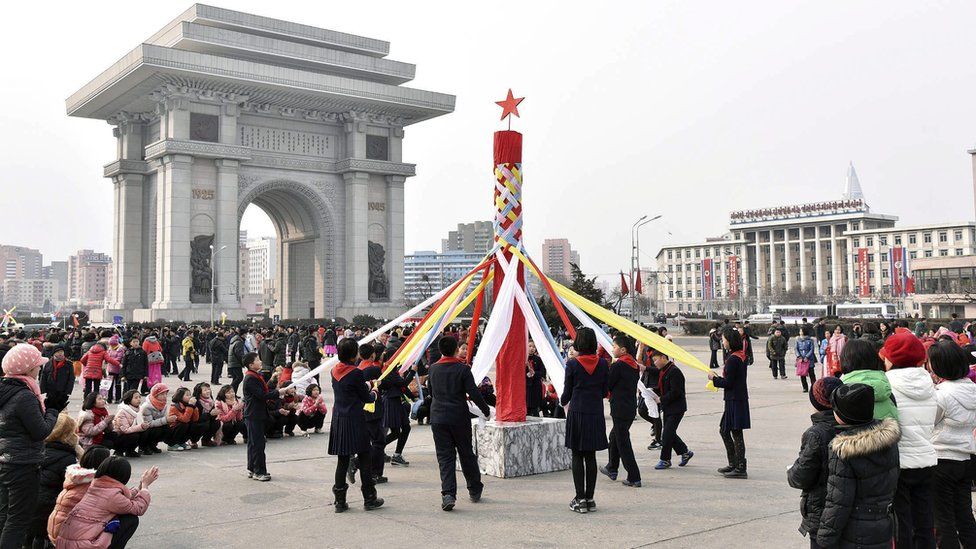 North Koreans celebrate the country's launch of a long-range rocket, in Pyongyang, North Korea