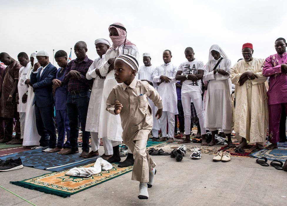 A young Muslim worshipper runs off during a mass prayer to celebrate Eid al-Fitr at the Stade des Martyrs in Kinshasa, DR Congo - 4 June 2019