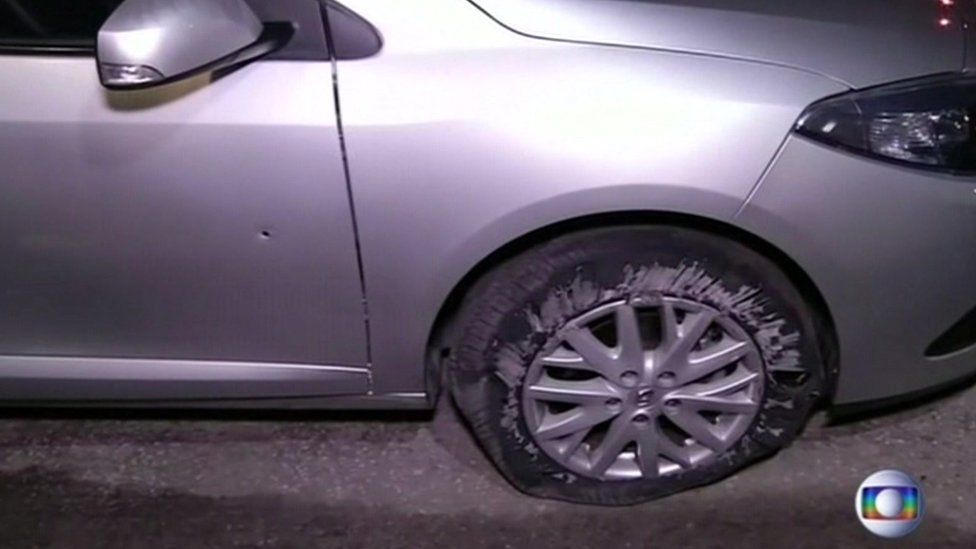 Images shown on Brazilian television show the family's car with a flattened tyre