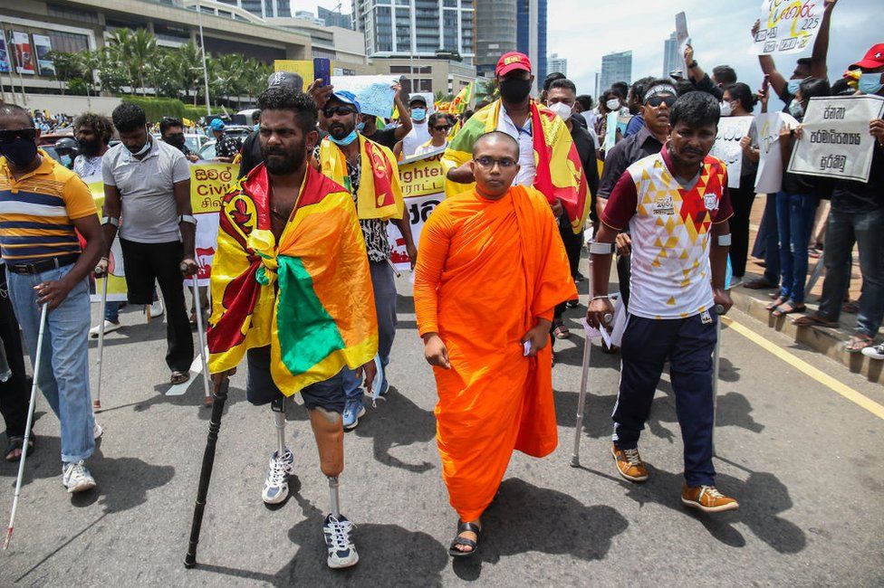 Sri Lankan retired soldiers held national flags and placards protesting on April 9, 2022, at Galle Face, Colombo.