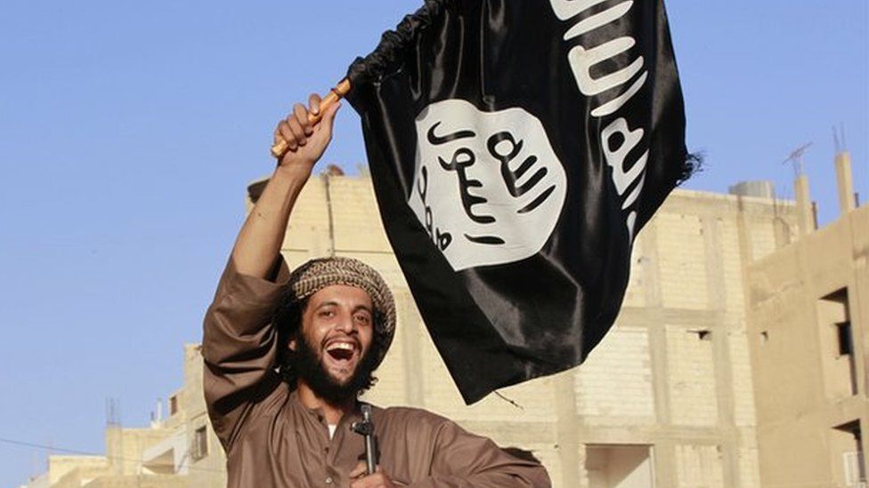 A militant islamist fighter takes part in an ISIS parade in Syria's eastern city of Raqqa June 30 2014
