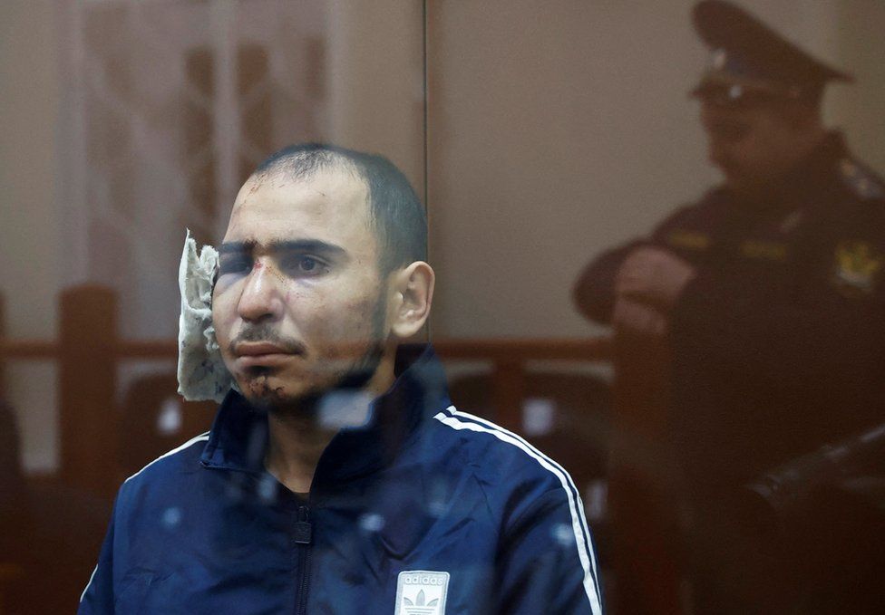 Saidakrami Murodali Rachabalizoda, a suspect in the shooting attack at the Crocus City Hall concert venue, sits behind a glass wall of an enclosure for defendants at the Basmanny district court in Moscow, Russia March 24, 2024.
