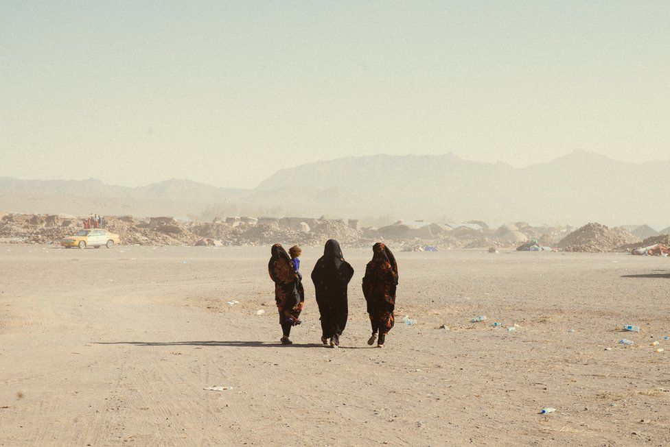 A group of Afghan women walking in Nayeb Rafi village