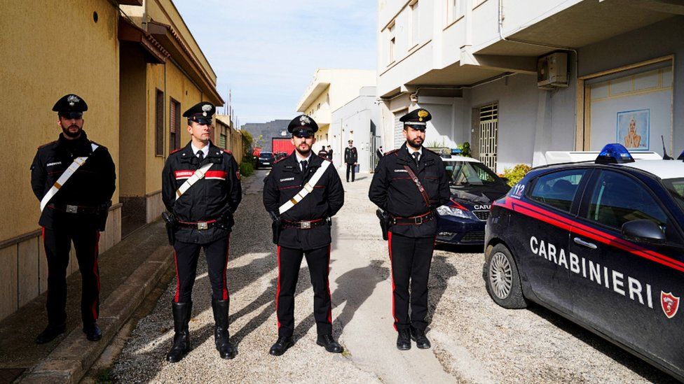 Italian police stand guard outside Matteo Messina Denaro's hideout