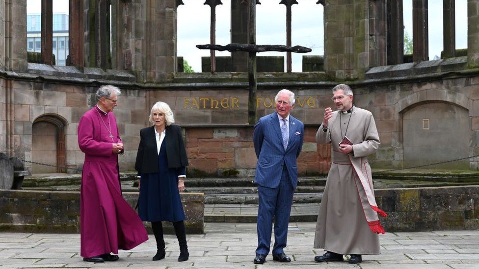 Rev Christopher Cocksworth (L) and the Dean of Coventry Rev John Witcombe (R) as they look at the ruins of the Old Cathedral during their visit to Coventry Cathedral with the King annd Queen.