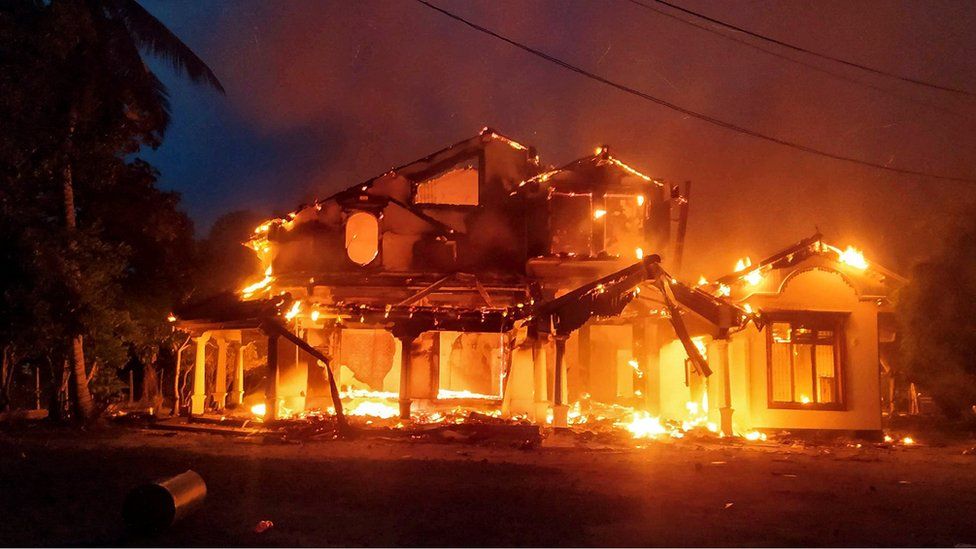Anti-government demonstrators set fire on the house owned by minister Sanath Nishantha of resigned Prime Minister Mahinda Rajapaksa"s cabinet after ruling party supporters stormed anti-govt protest camp, amid the country"s economic crisis, in Arachchikattuwa, Sri Lanka, April 9 May 2022.