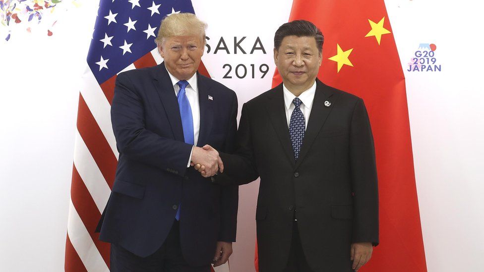 Chinese President Xi Jinping (R) shakes hands with US President Donald Trump before a bilateral meeting during the G20 Summit on June 29, 2019 in Osaka, Japan.