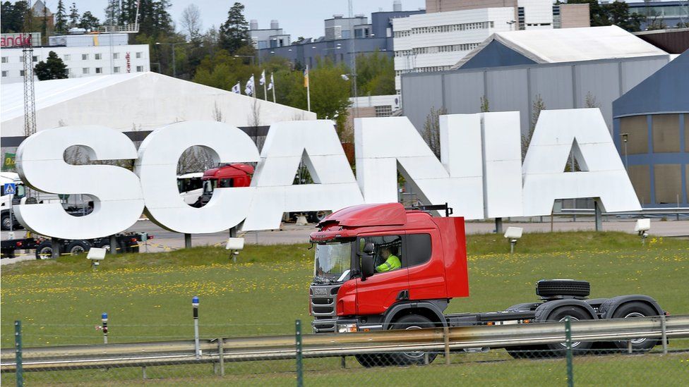 Scania truck outside giant logo
