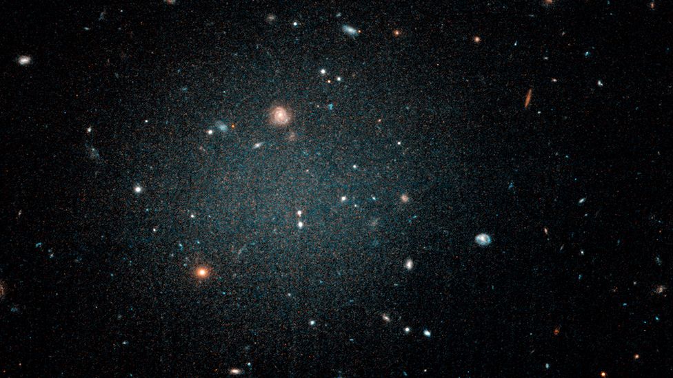 A diffuse fuzzy blob with other galaxies visible behind it