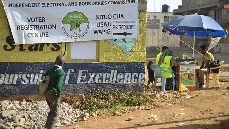 A school boy looks at a banner advertising a voter-registration point January 18, 2017