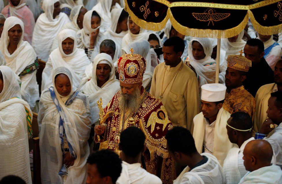 An Ethiopian Orthodox priest blesses faithful during an Easter eve prayer in Addis Ababa, Ethiopia, April 15, 2017. Picture REUTERS/Tiksa Negeri