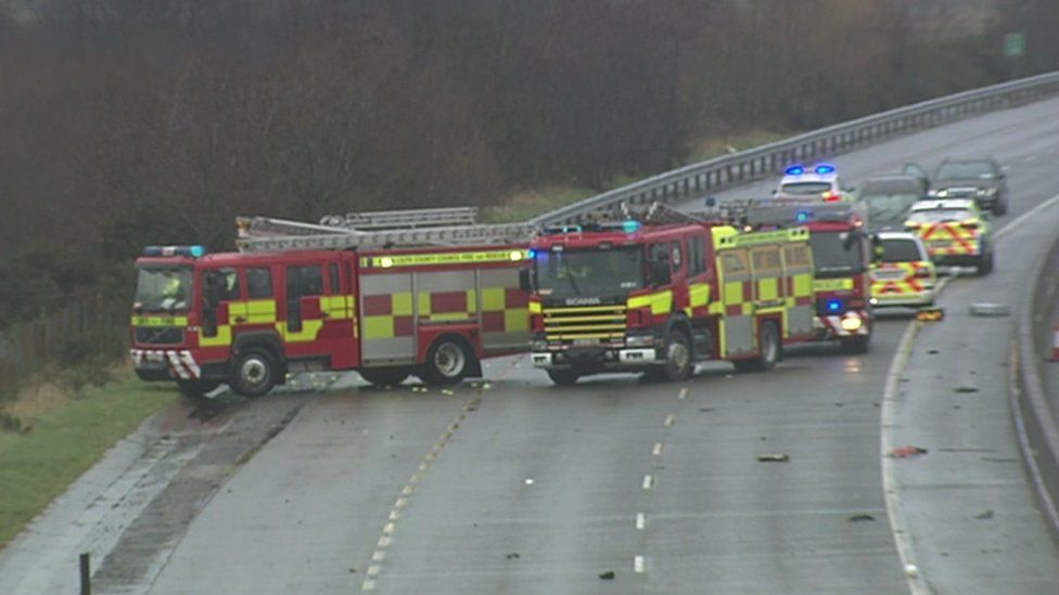 Fire engines and police cars at the scene of the crash in County Louth