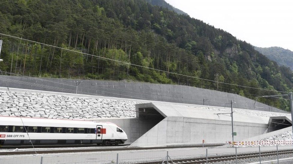 First train enters tunnel near Erstfeld, 1 June