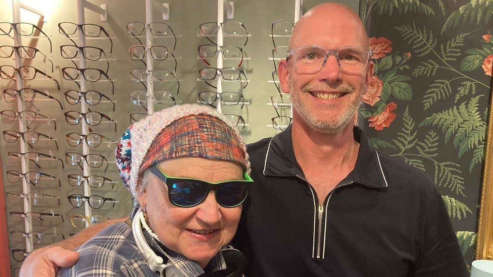 Sheila Irvine with David Canton at his opticians