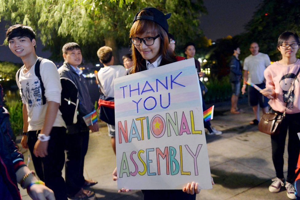 In picture made available on 25 November 2015 show a member of the local lesbian, gay, bisexual and transgender (LGBT) community holding a banner during a gathering to celebrate a new law approved by the National Assembly, in Hanoi, Vietnam, 24 November 2015.