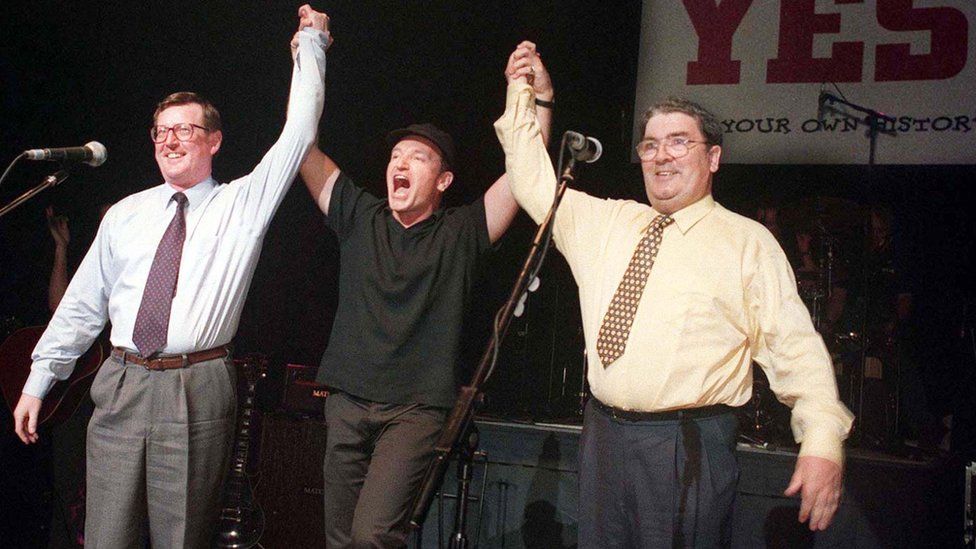 David Trimble, Bono and John Hume pictured together on stage in Belfast in 1998