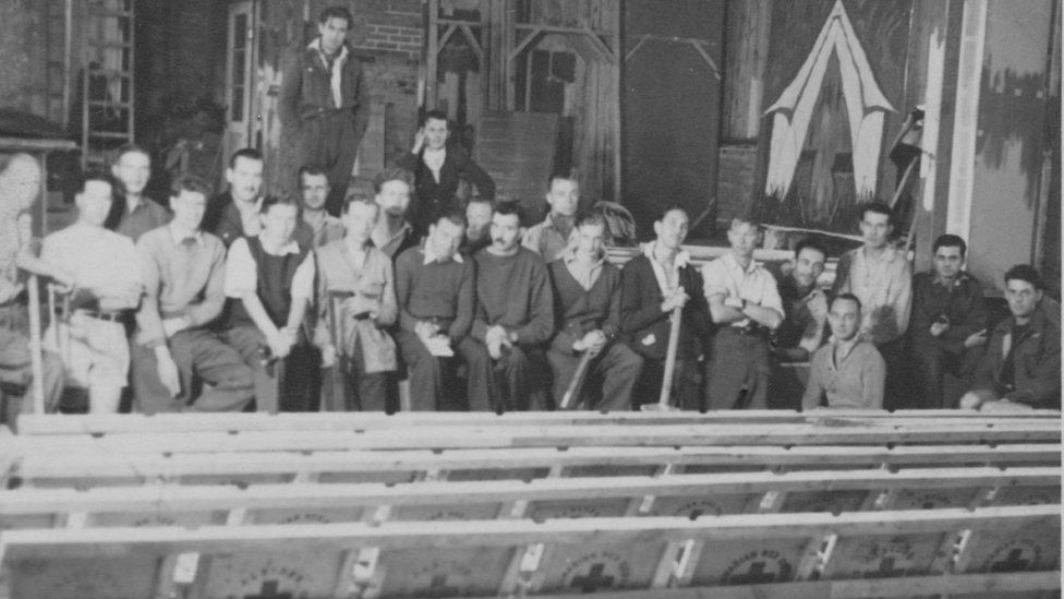 Peter Butterworth (standing at the back) with the theatre company at Stalag Luft 3