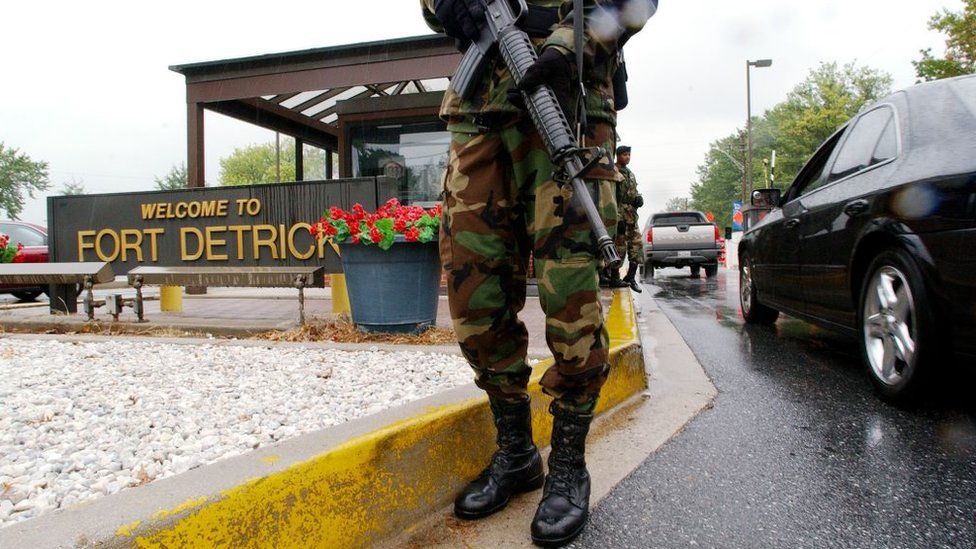 Military Personnel stand guard outside the US Army Medical Research Institute of Infectious Diseases at Fort Detrick