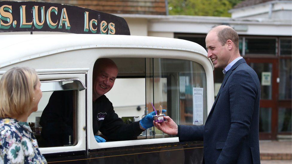 Prince William receives ice cream during a visit to the Queen's Bay Lodge Care Home