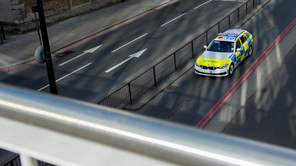 Generic photo of police car on motorway