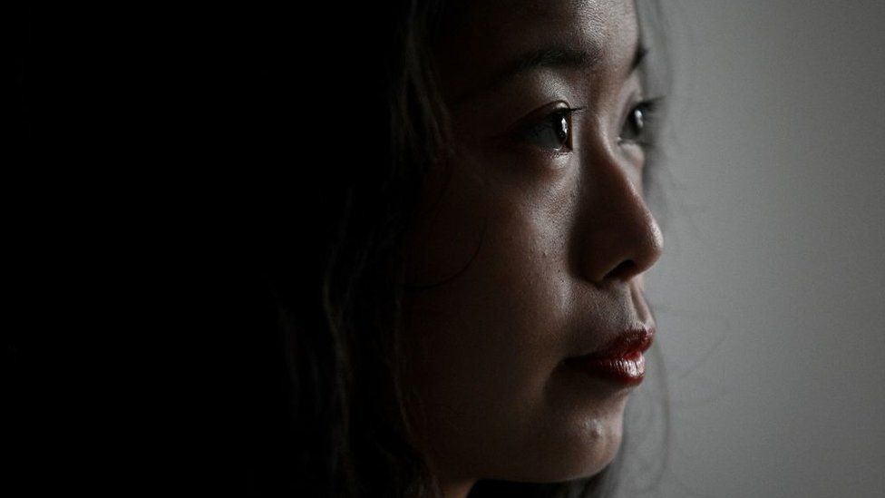 Zhou Xiaoxuan, a feminist figure who rose to prominence during China's #MeToo movement two years ago, answers questions during an interview at her house in Beijing on December 2, 2020, before heading to a court hearing at the Haidian District Peoples Court in a sexual harassment case against one of China's best-known television hosts.