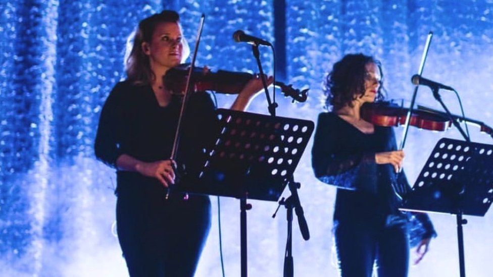 Katie Kresek (left) performing before the coronavirus pandemic