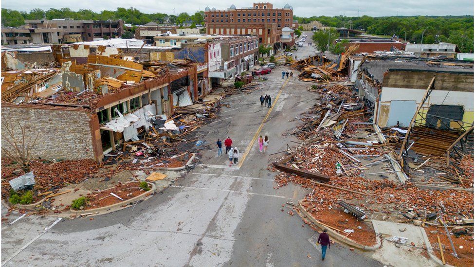 An aerial view of buildings damaged in tornadoes