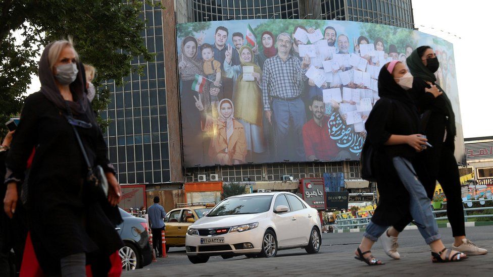 A banner for the presidential election is seen in Valiasr square in Tehran, Iran (16 June 2021)