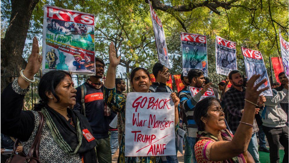 Activists of All India Democratic Students Organisation (AIDSO) hold placards as they shout slogans against the arrival of US President during a protest demonstration against US President Donald Trump