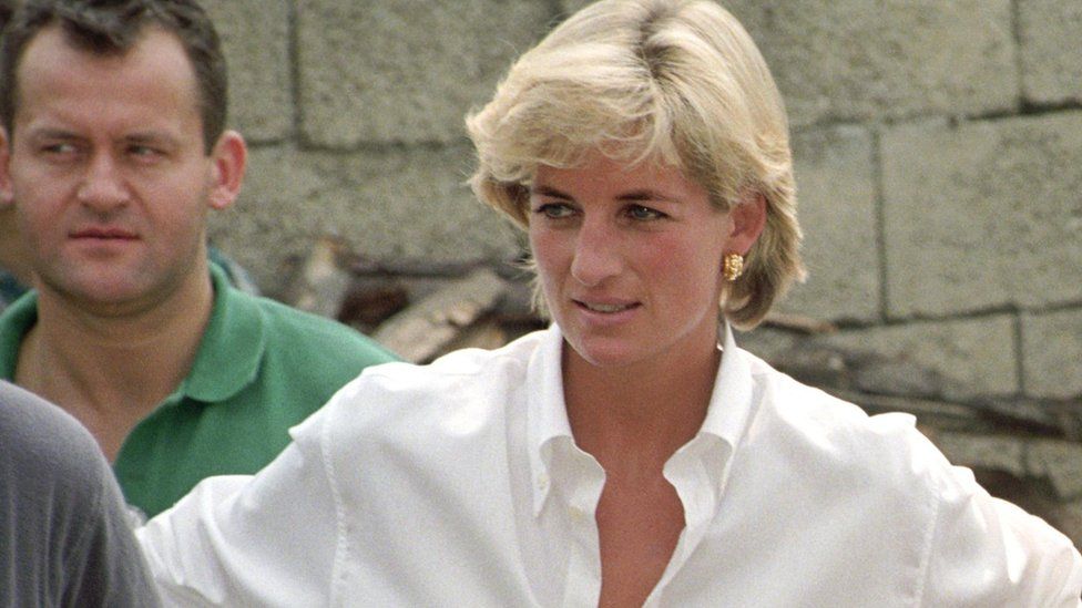 Diana, Princess of Wales, with Paul Burrell in the background