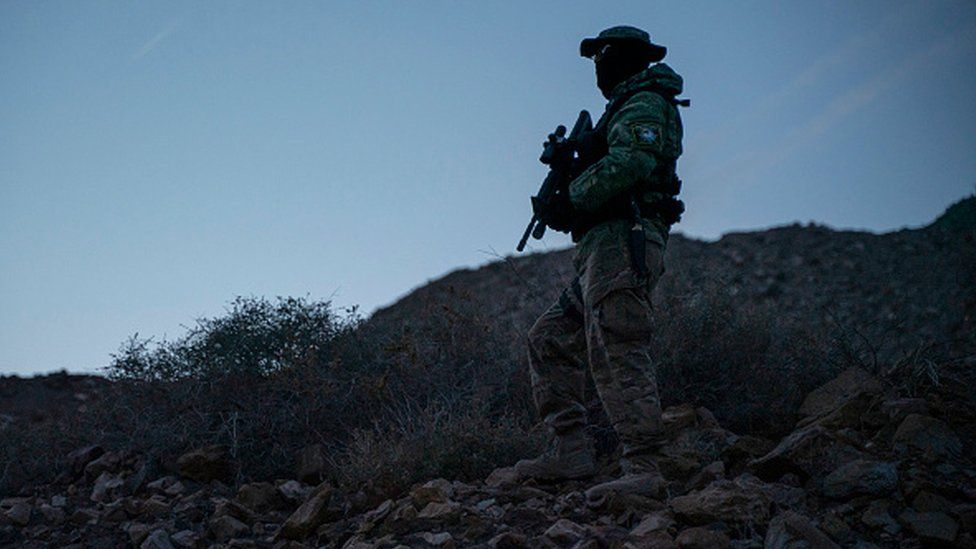 A member of Constitutional Patriots New Mexico Border Ops Team militia is pictured on patrol at the US-Mexico border