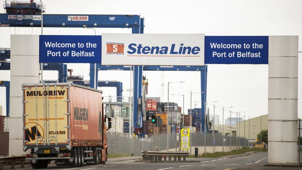 A lorry and its trailer enter a ferry terminal at Belfast Port