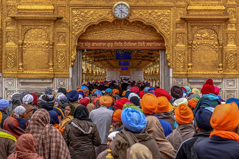 Sikh devotees gather to pay respect on the occasion of Maghi festival at the Golden Temple in Amritsar, India, on 14 January 2022