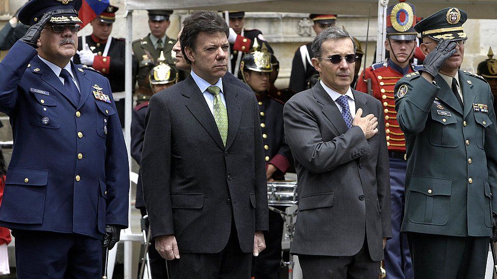 Alvaro Uribe and Juan Manuel Santos in a military parade