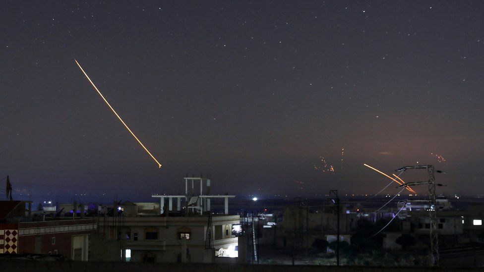 Missile fire seen over the southern Syrian city of Deraa on 10 May 2018