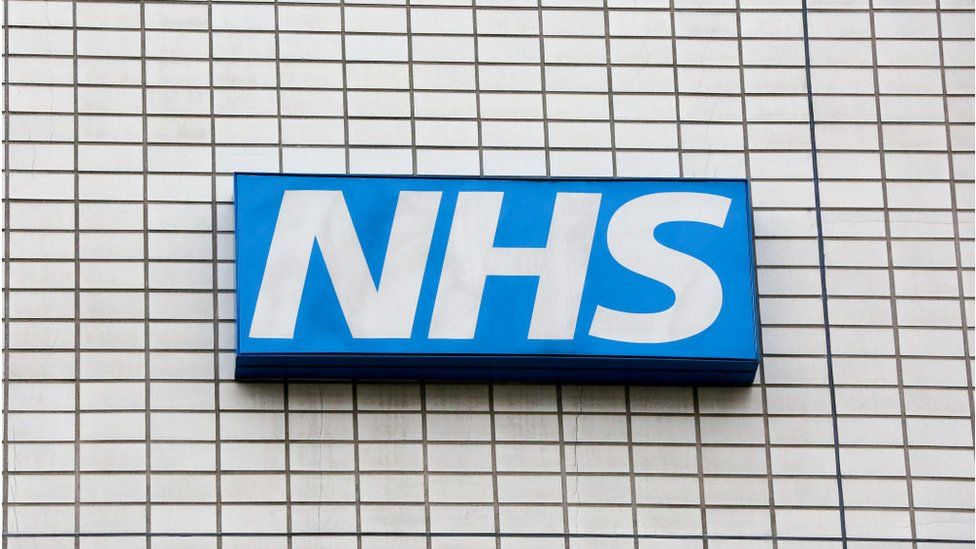 NHS logo on hospital building