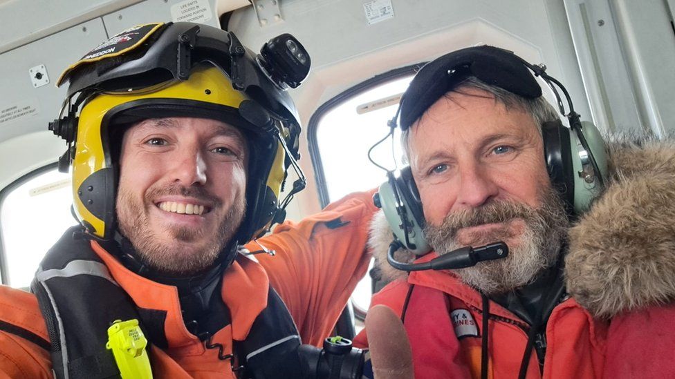 Cam Cameron, right, was rescued by a search and rescue helicopter from Stornoway on Wednesday