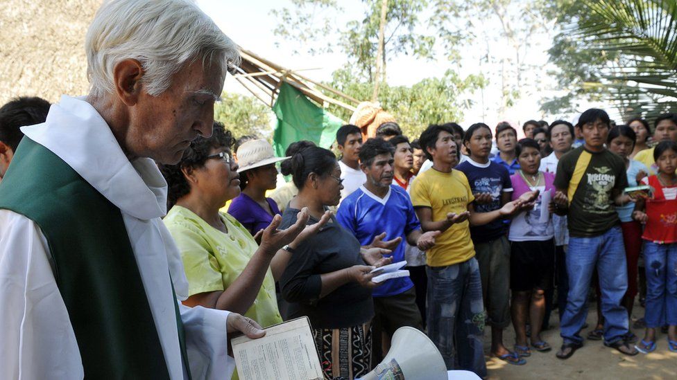 A priest giving Mass in the Amazon