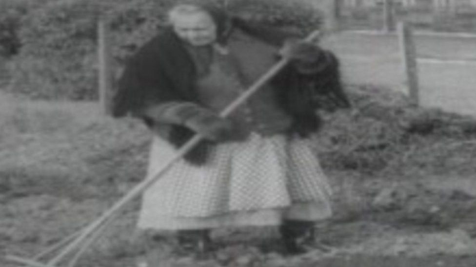 1965 image of Woman gardening at Penrhos Polish Home, Pwllheli, Gwynedd