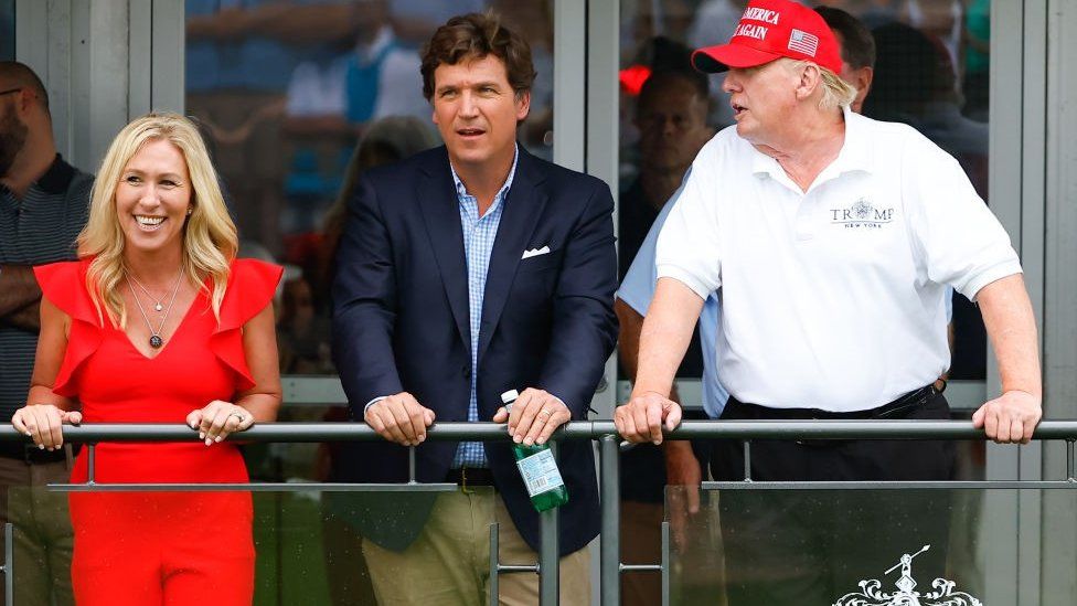 Tucker Carlson with Donald Trump in July 2022
