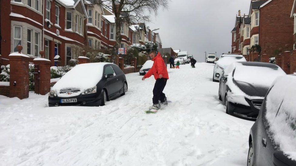 Back in Barry, with no cars on the move, some of the roads were being used for snowboarding