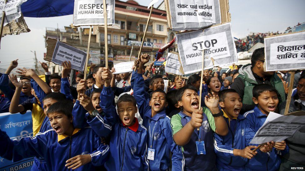 Nepalese students holding placards take part in a protest to show solidarity against the border blockade in Kathmandu, Nepal November 27, 2015.