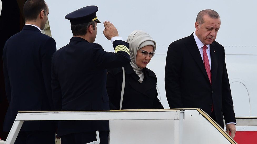 Turkish President Recep Tayyip Erdogan and his wife Emine Erdogan step off their plane upon arrival in Buenos Aires on November 29, 2018
